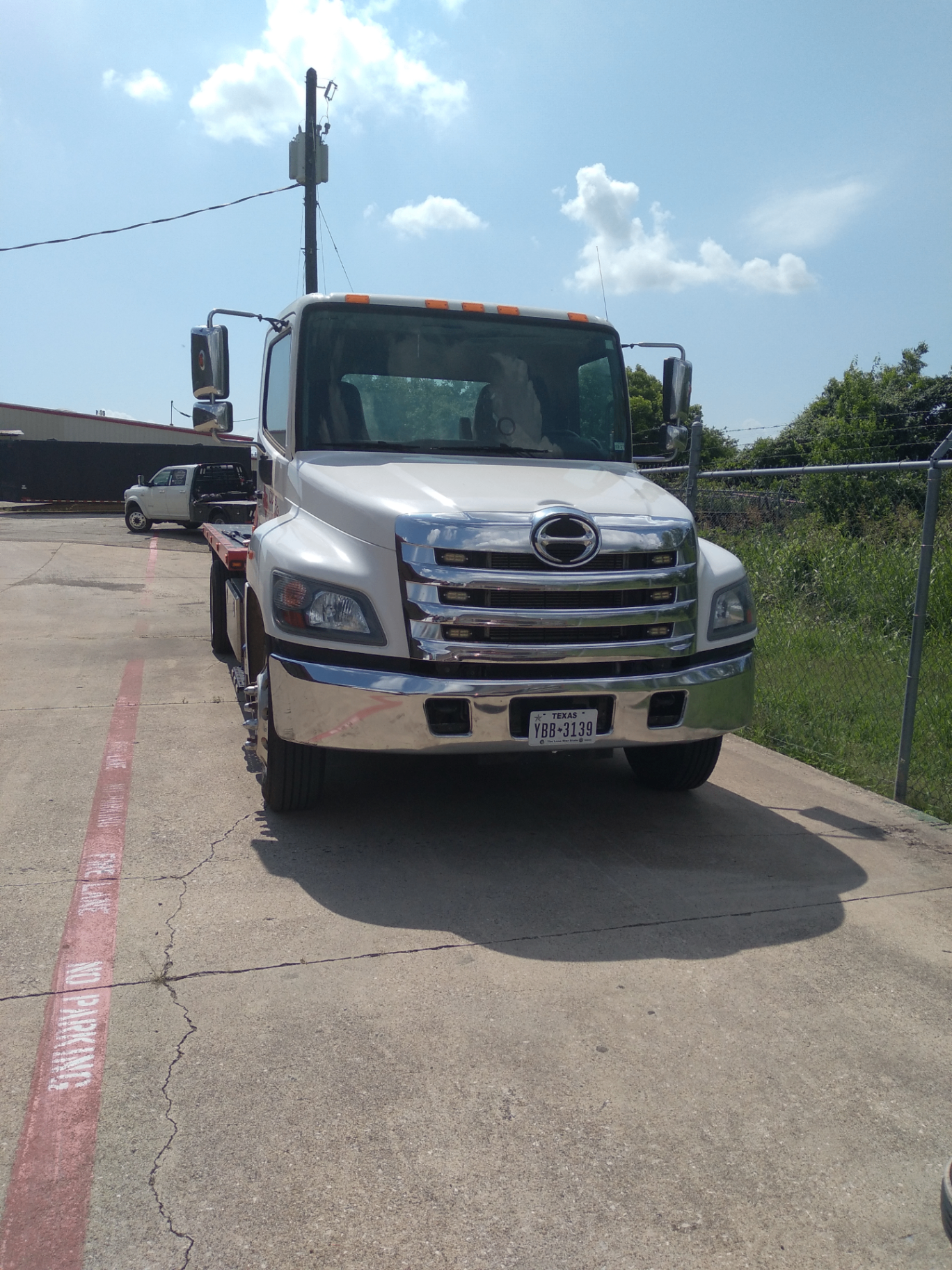 CC's Towing flatbed truck — front view
