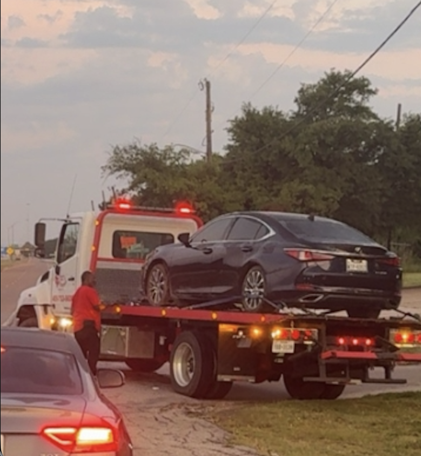 CC's Towing flatbed loading a customer's car