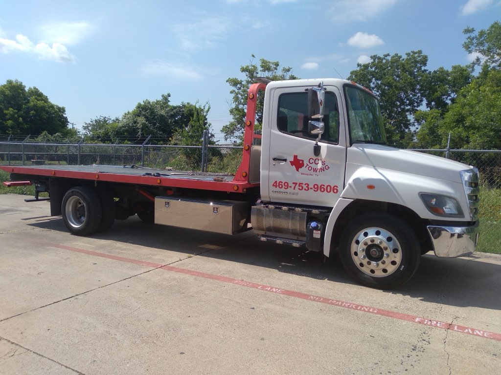 CC's Towing flatbed truck — side view